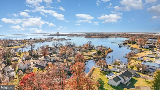 a view of a terrace with lake view and boat