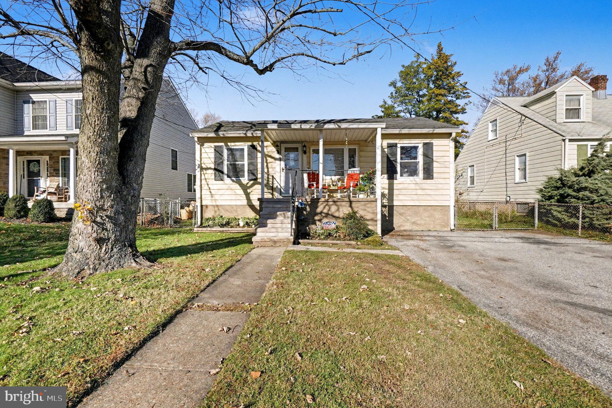 7316 Hughes Avenue Baltimore, MD 21219 - Photo 5 of 43 front view of a house with a porch