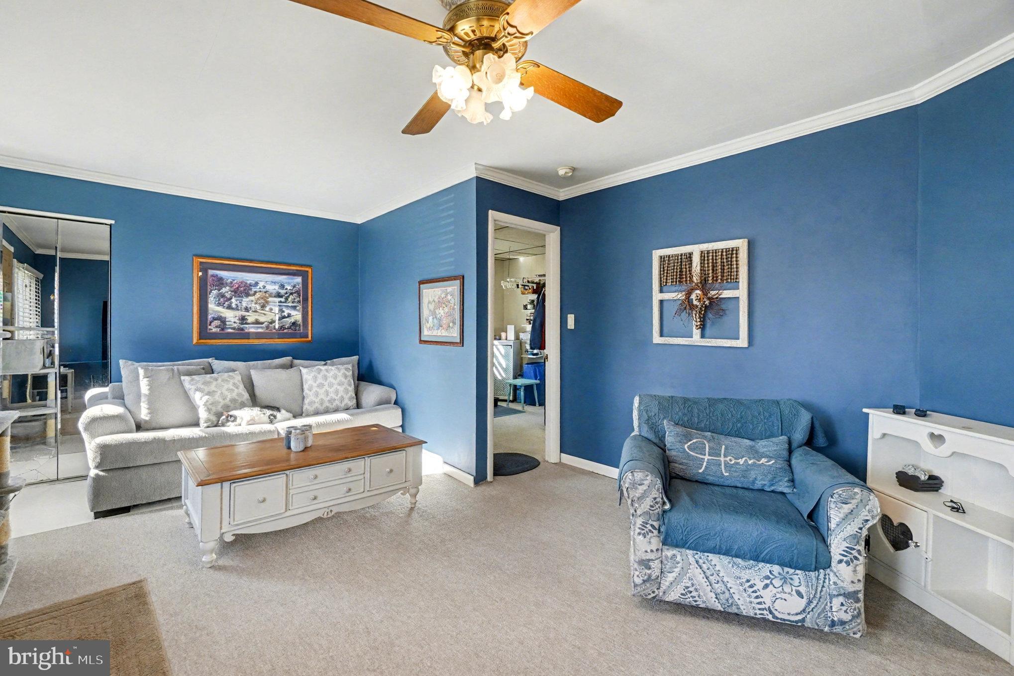 7316 Hughes Avenue Baltimore, MD 21219 - Photo 8 of 43 a living room with furniture and a ceiling fan