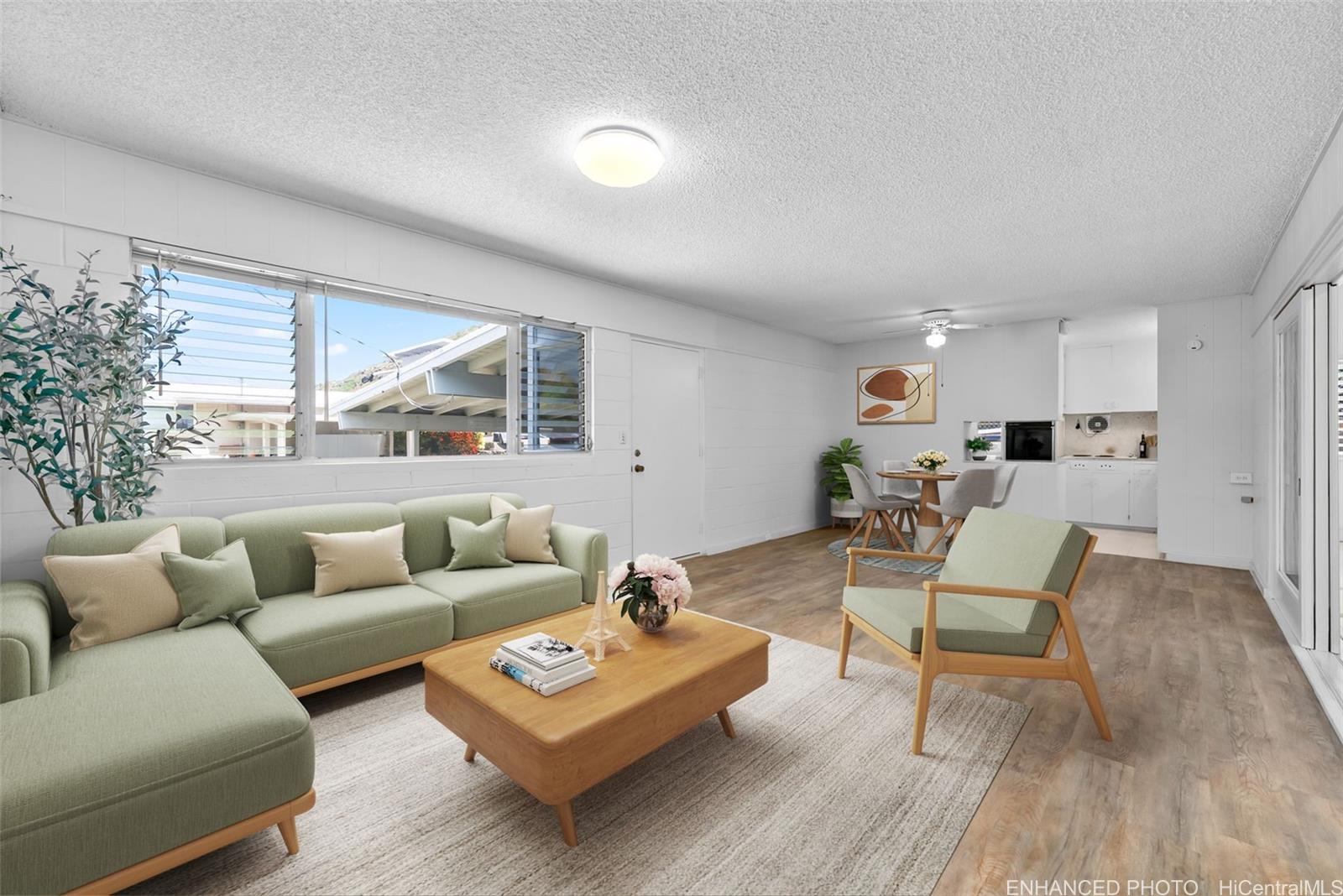 6014 Aimoku Street Honolulu, HI 96821 - Photo 7 of 25 Virtually staged living room looking towards the kitchen. Enhanced