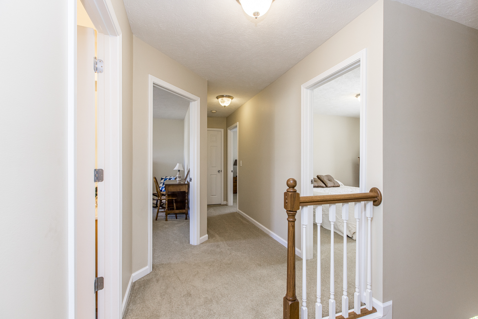 1511 Biltmore Court Normal, IL 61761 - Photo 14 of 35 a view of a room that has a bed and a mirror in it