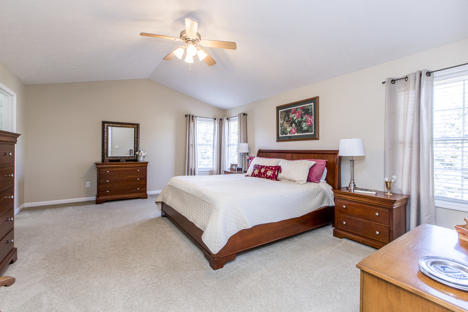 1511 Biltmore Court Normal, IL 61761 - Photo 15 of 35 a spacious bedroom with a bed and a chandelier