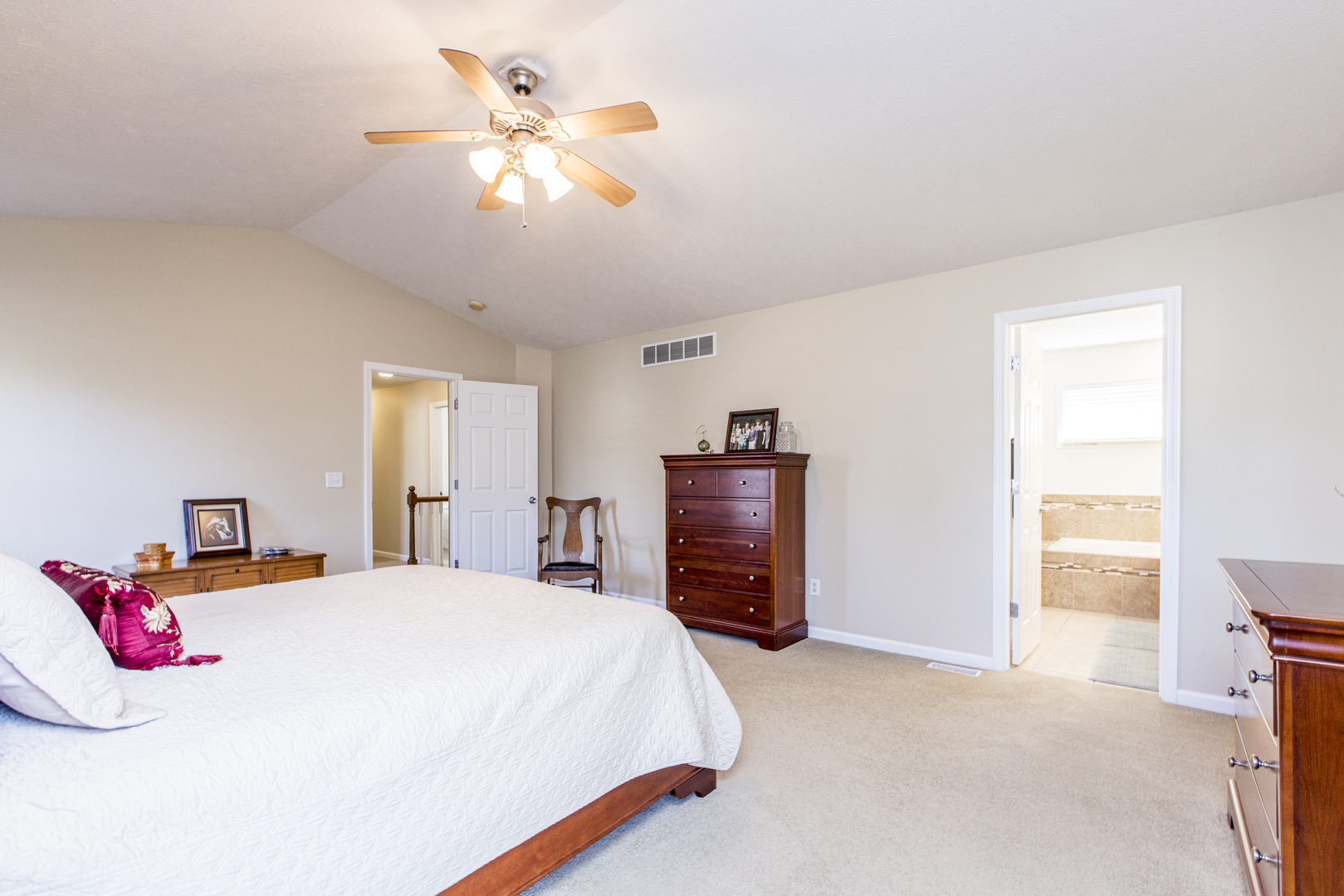 1511 Biltmore Court Normal, IL 61761 - Photo 17 of 35 a bedroom with a bed and a chandelier
