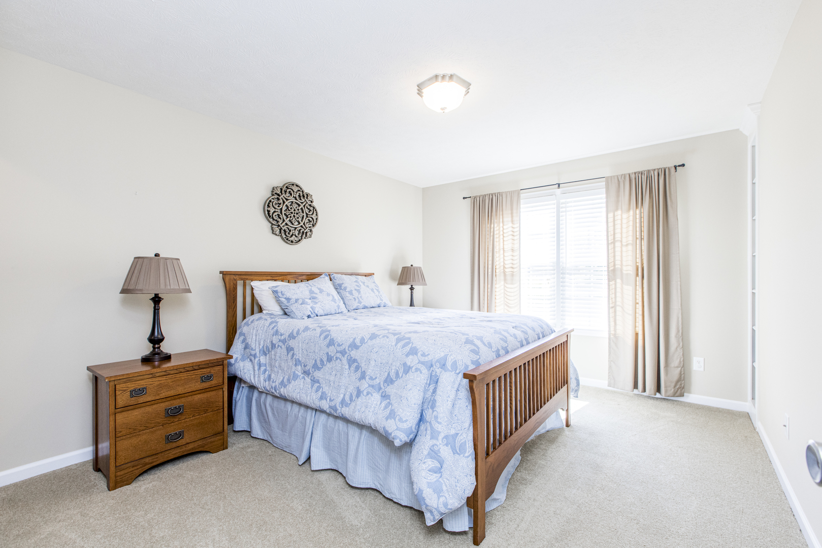 1511 Biltmore Court Normal, IL 61761 - Photo 24 of 35 a bedroom with a bed and a lamp