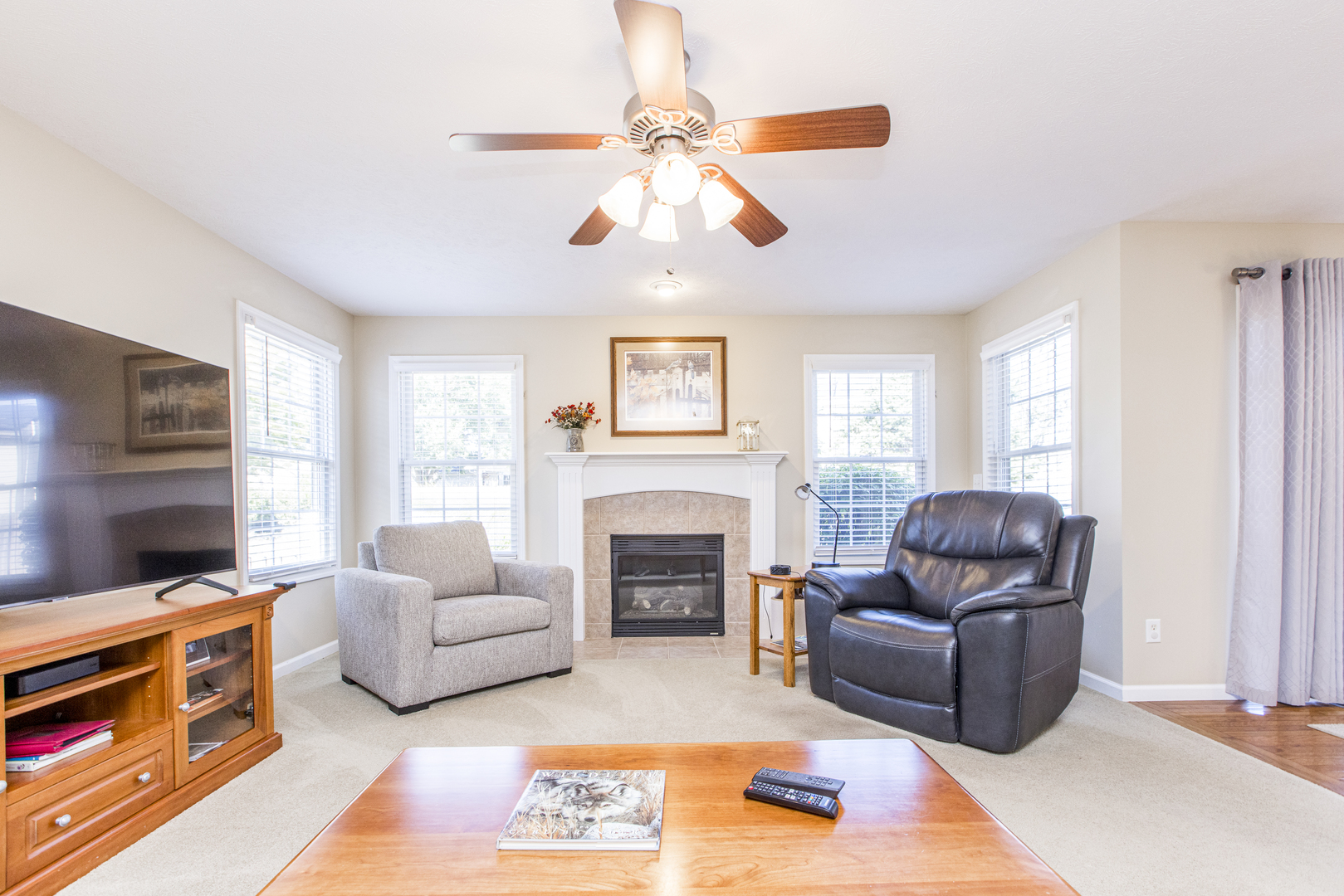 1511 Biltmore Court Normal, IL 61761 - Photo 7 of 35 a living room with furniture a flat screen tv and a fireplace