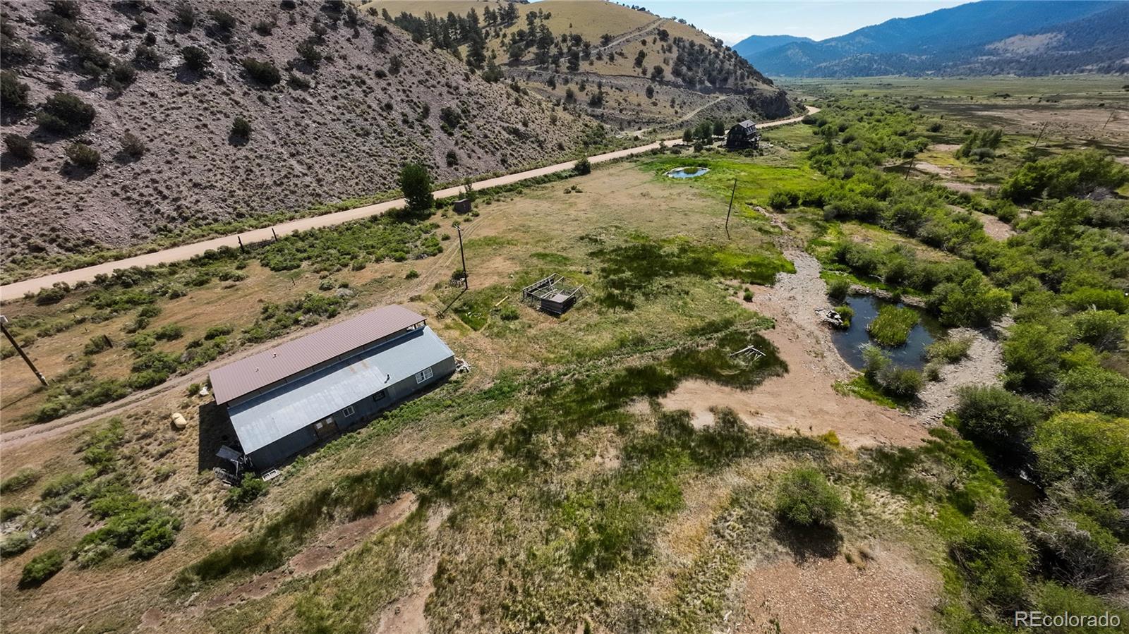 50002 County Rd LL56 Villa Grove, CO 81155 - Photo 1 of 40 a view of a yard with wooden fence
