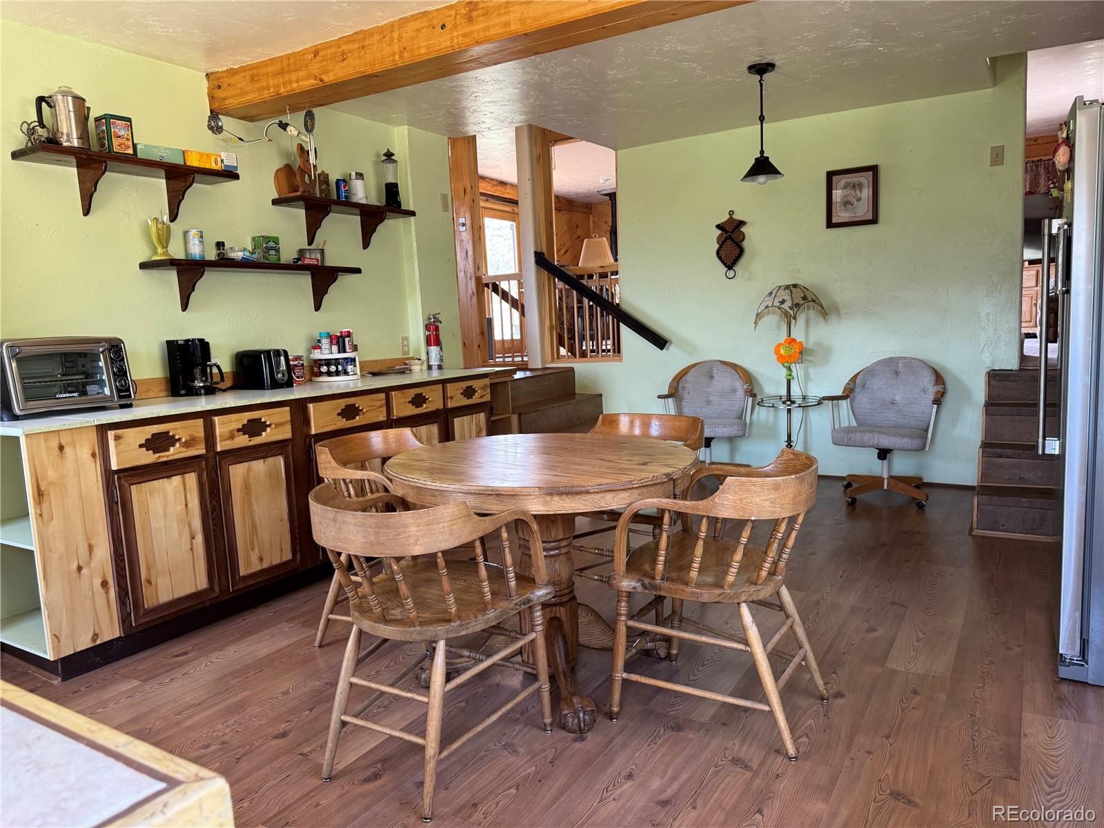 50002 County Rd LL56 Villa Grove, CO 81155 - Photo 23 of 40 a view of a dining room with furniture and wooden floor