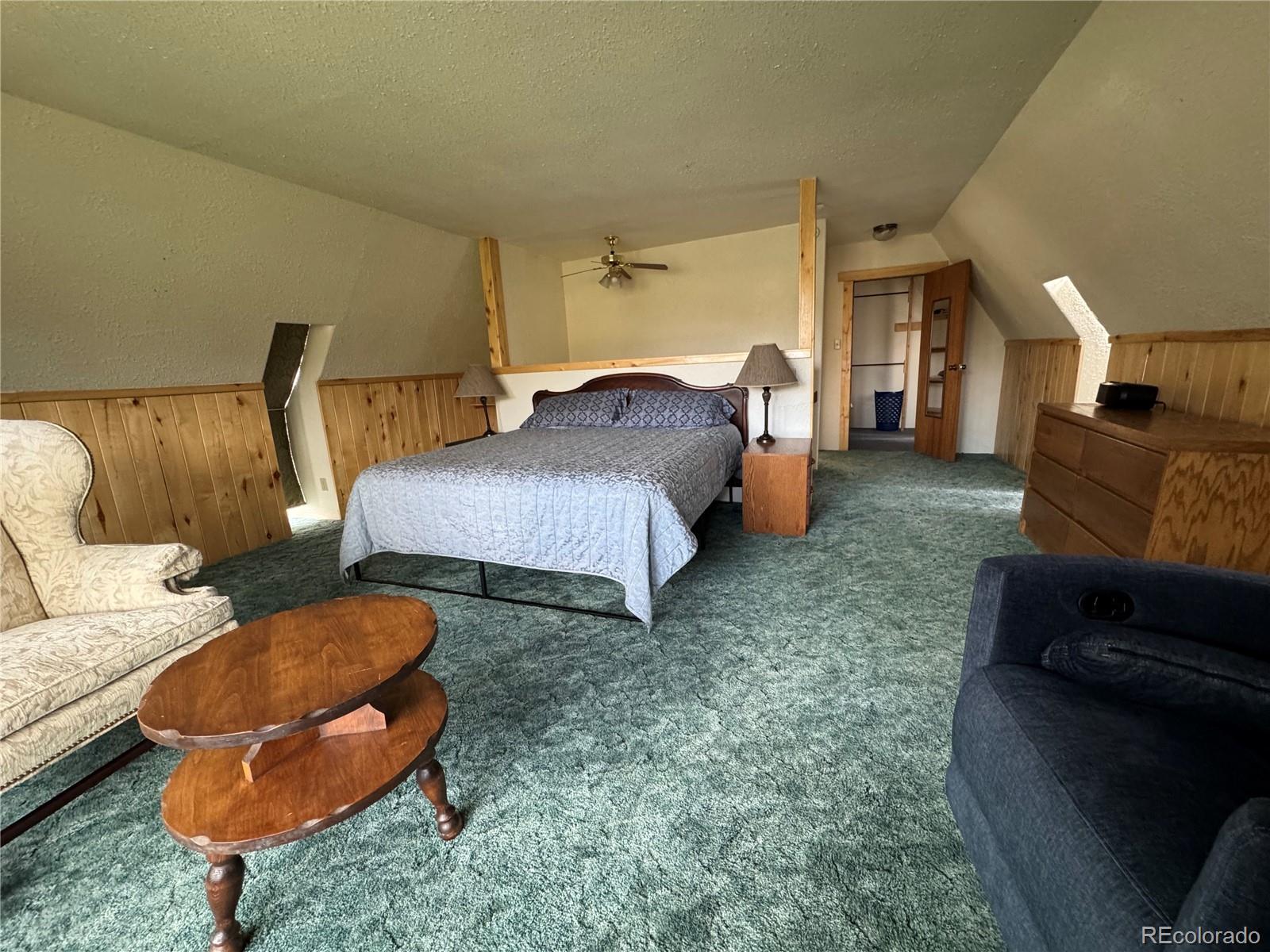 50002 County Rd LL56 Villa Grove, CO 81155 - Photo 24 of 40 a spacious bedroom with a bed and a couch