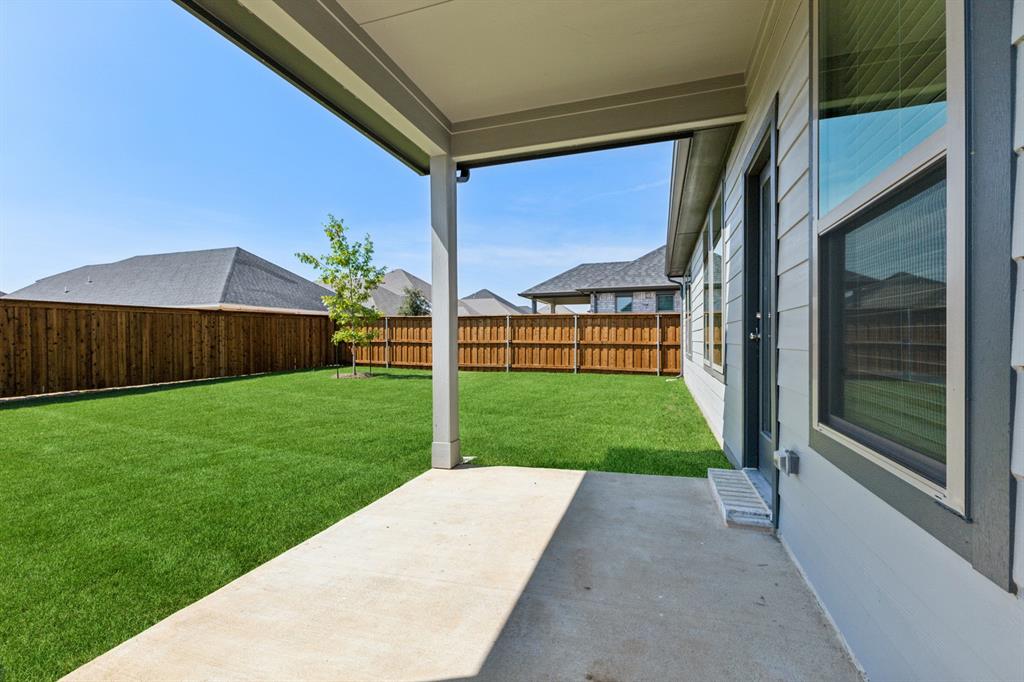 676 Poppy Lane Lavon, TX 75166 - Photo 33 of 35 Covered Patio in the Masters home plan by Trophy Signature Homes – REPRESENTATIVE PHOTO
