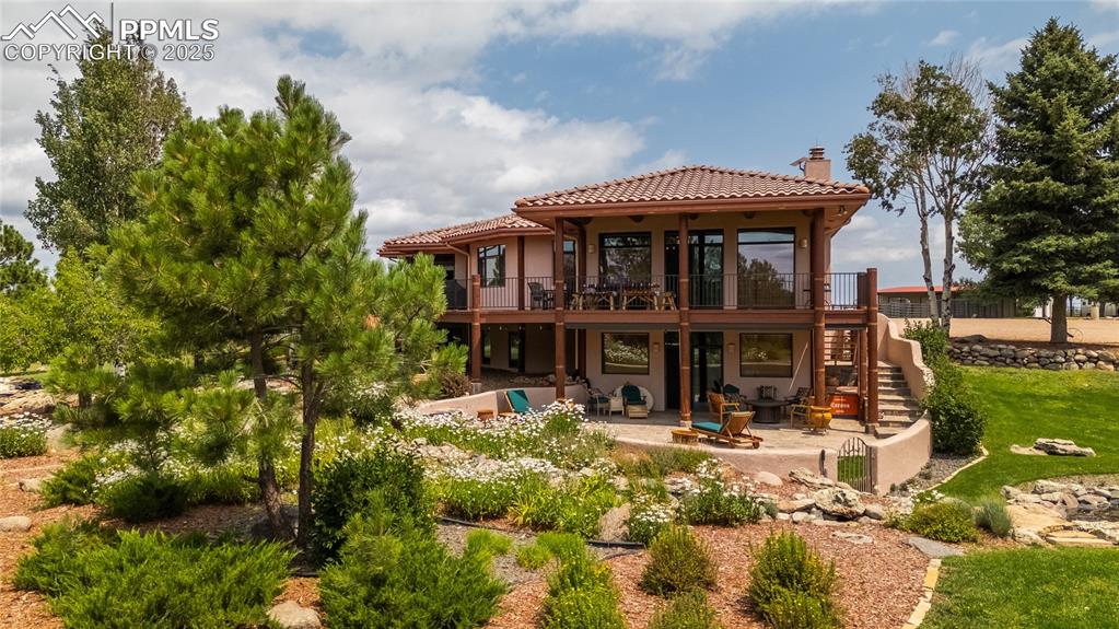 a front view of a house with garden