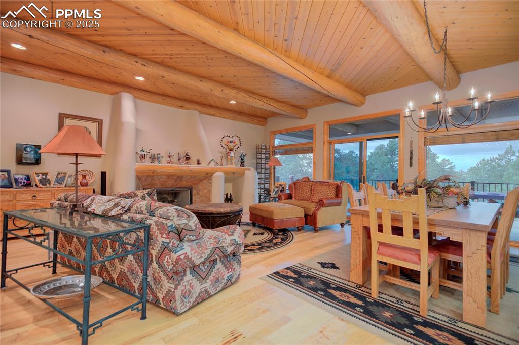 11771 East Smith Road Elbert, CO 80106 - Photo 11 of 35 a large living room with lots of furniture and chandelier