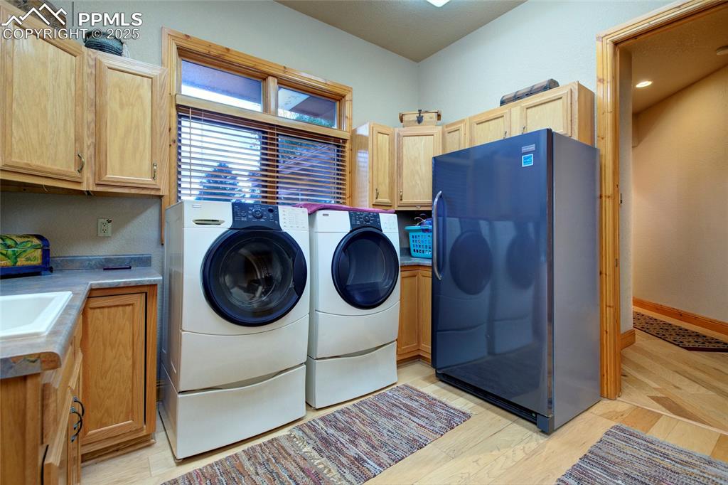 11771 East Smith Road Elbert, CO 80106 - Photo 18 of 35 a utility room with dryer and washer