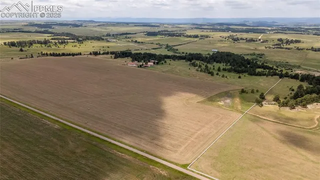 a bathroom with a granite countertop double vanity sink and a mirror