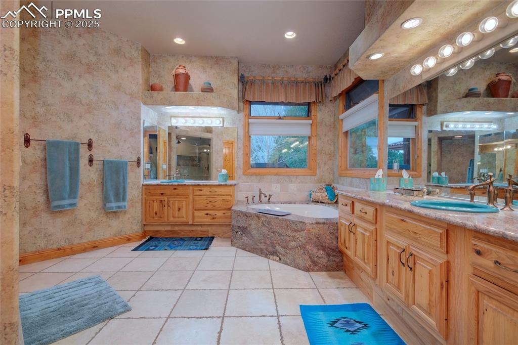 11771 East Smith Road Elbert, CO 80106 - Photo 29 of 35 a large bathroom with a large tub and sink