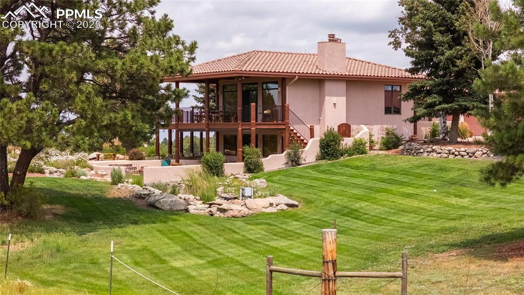 11771 East Smith Road Elbert, CO 80106 - Photo 3 of 35 a view of a table and chairs in patio