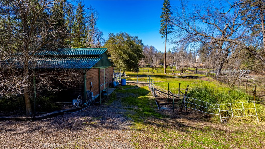 -4.53 Ac Wortham Road Oakhurst, CA 93644 - Photo 3 of 19 a view of a swimming pool with a patio and a yard