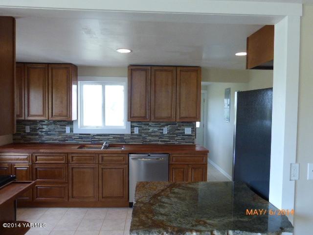 12606 Nelson Road Yakima, WA 98903 - Photo 5 of 21 a kitchen with a sink and cabinets