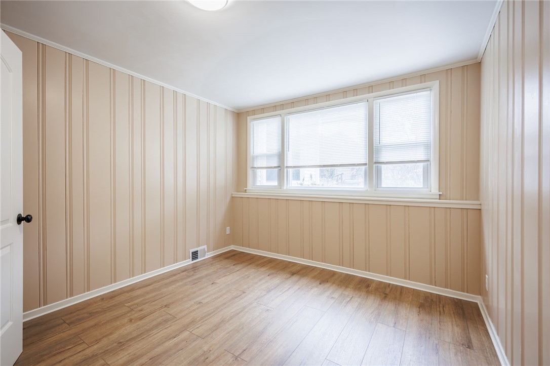 6 Jeanmoor Road Greece, NY 14616 - Photo 5 of 31 First floor Bedroom with luxury vinyl flooring & c