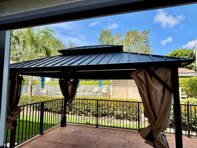 a view of balcony with wooden floor and outdoor seating