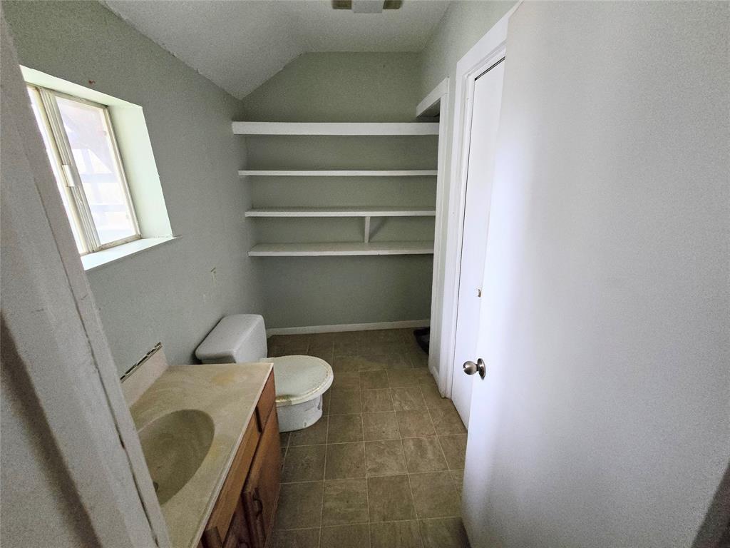 322 Capps Street Marlin, TX 76661 - Photo 17 of 34 a bathroom with a toilet and a sink