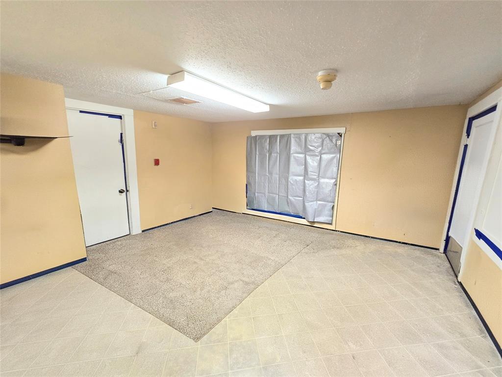 322 Capps Street Marlin, TX 76661 - Photo 22 of 34 an empty room with a natural light