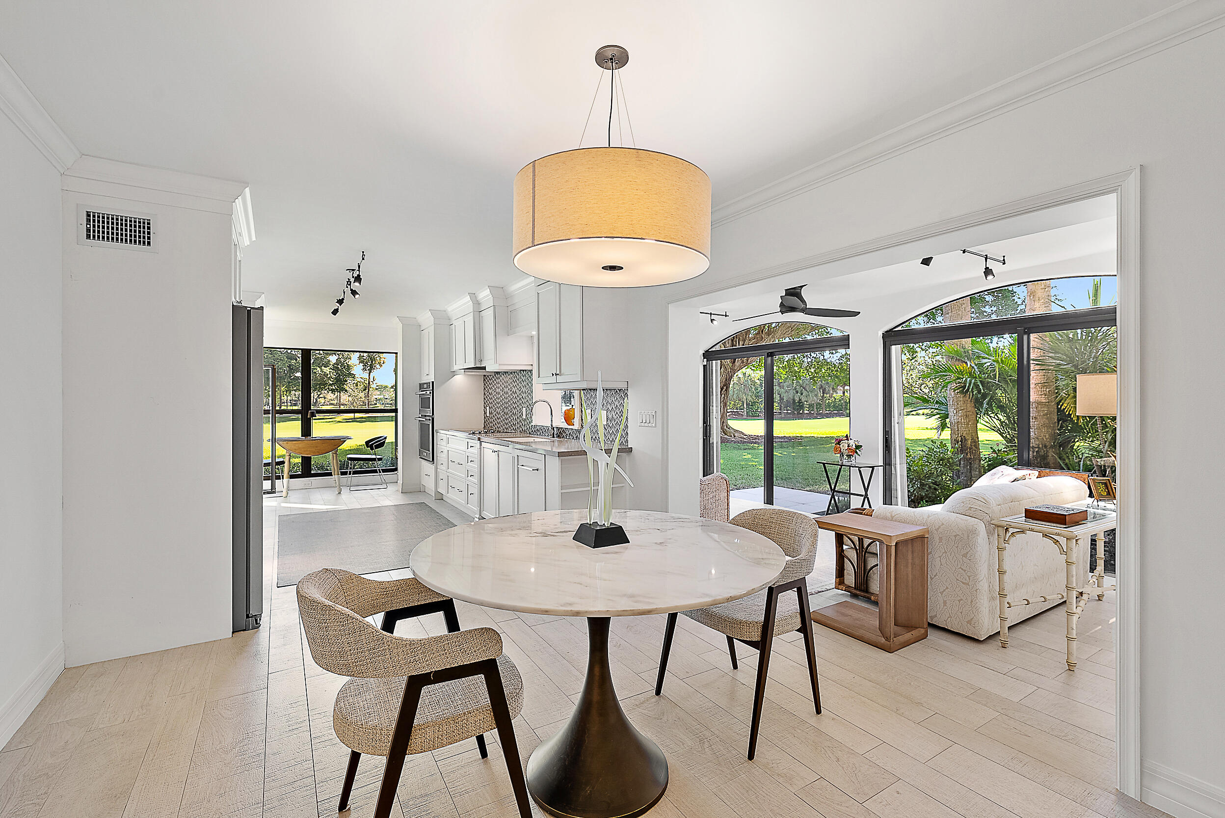 16648 Traders Crossing North, Unit 106 Jupiter, FL 33477 - Photo 11 of 37 a dining room with furniture and window