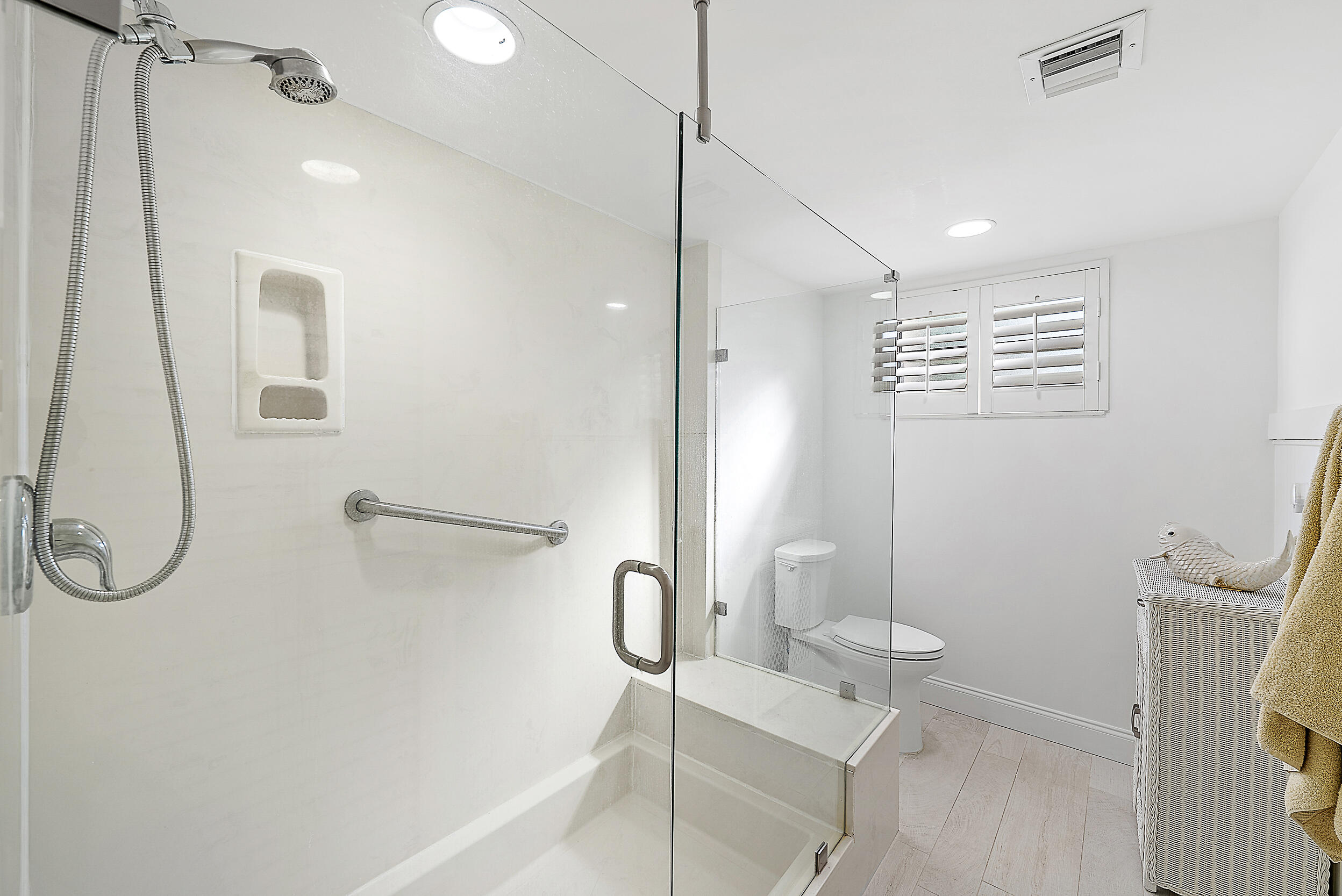 16648 Traders Crossing North, Unit 106 Jupiter, FL 33477 - Photo 15 of 37 a bathroom with a shower