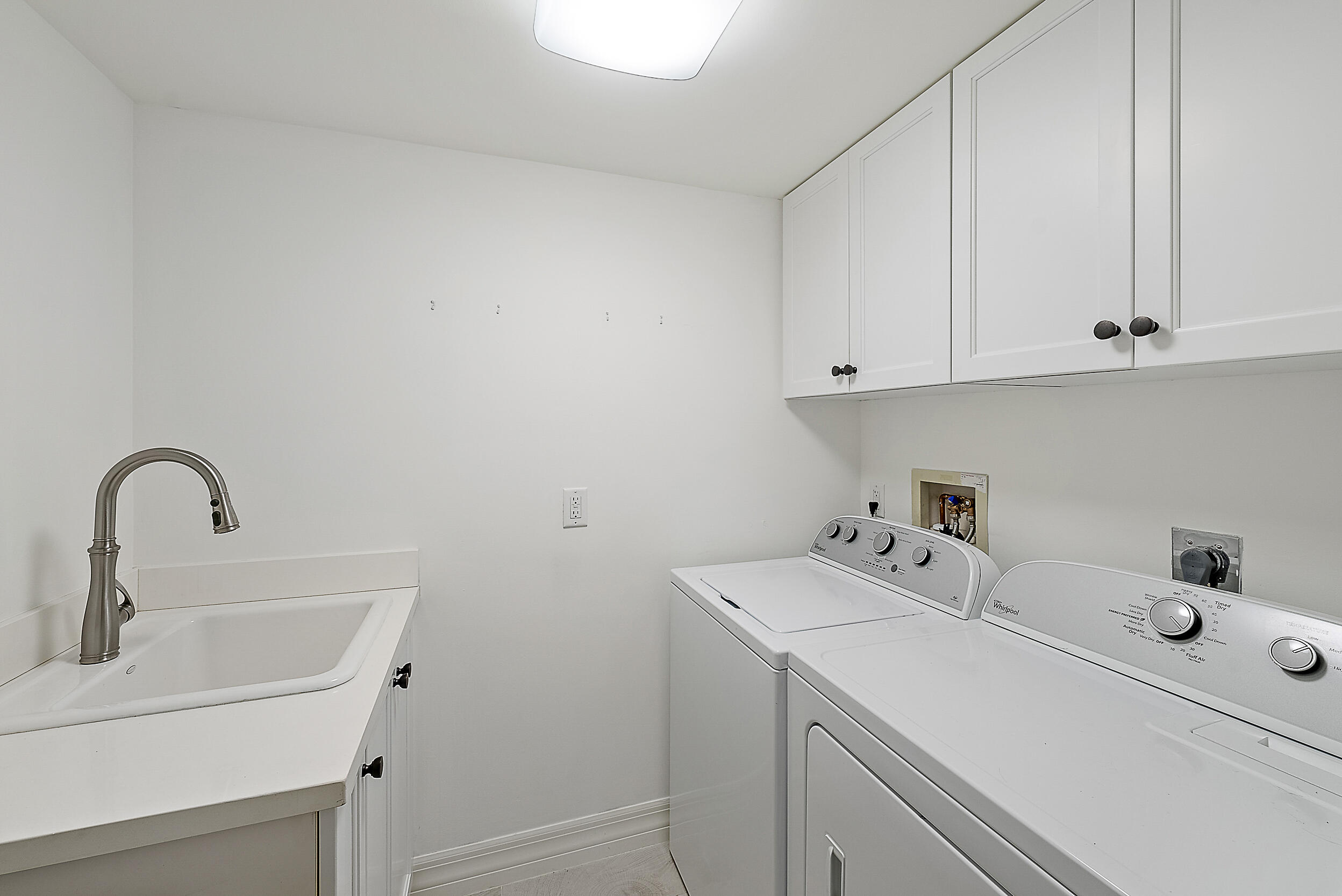 16648 Traders Crossing North, Unit 106 Jupiter, FL 33477 - Photo 18 of 37 a close view of sink and tap