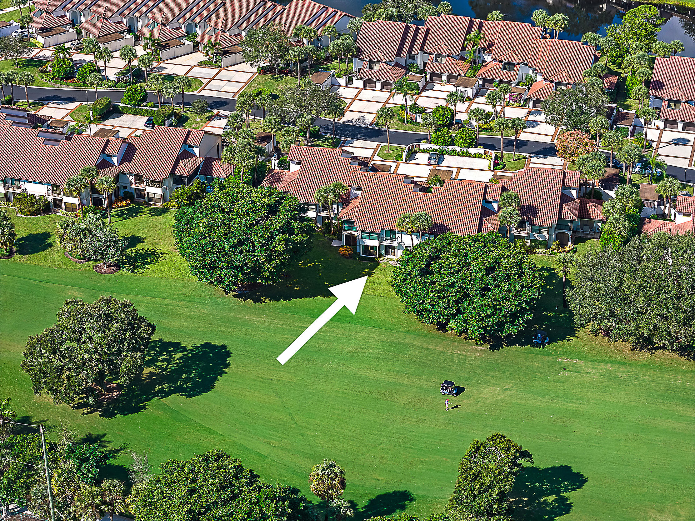16648 Traders Crossing North, Unit 106 Jupiter, FL 33477 - Photo 25 of 37 a view of a lake with a building in the background