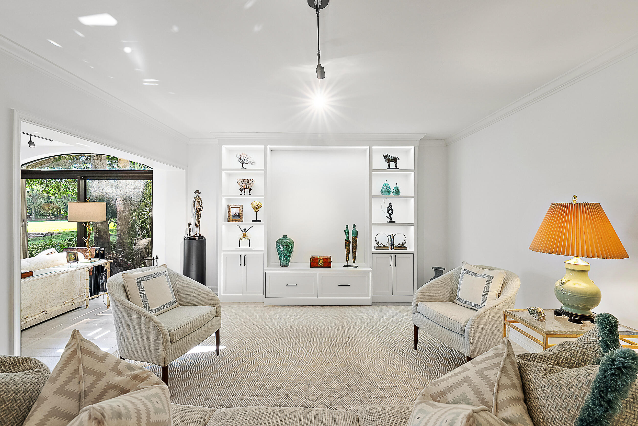 16648 Traders Crossing North, Unit 106 Jupiter, FL 33477 - Photo 7 of 37 a living room with furniture and a lamp