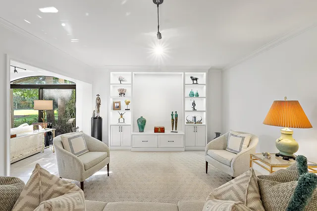 a living room with furniture and a lamp