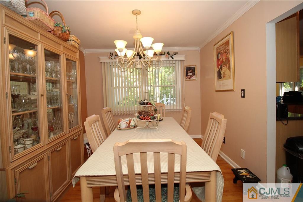 21 Frances Road Edison, NJ 08820 - Photo 11 of 20 a view of a dining room with furniture and chandelier