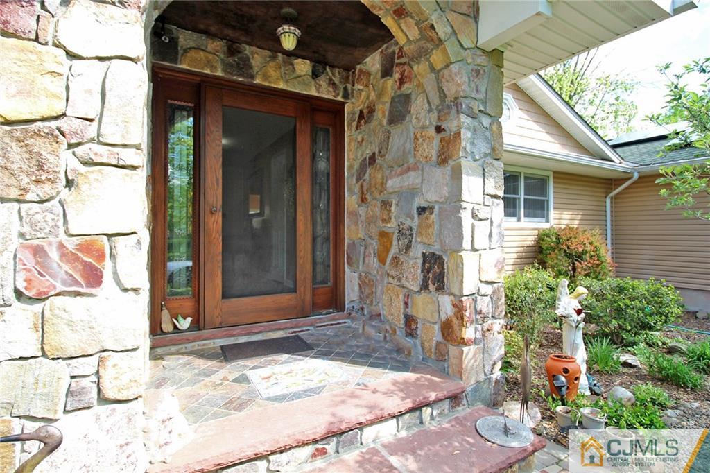 21 Frances Road Edison, NJ 08820 - Photo 13 of 20 a view of a brick house with a potted plant