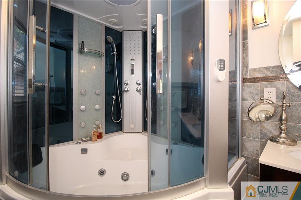 21 Frances Road Edison, NJ 08820 - Photo 16 of 20 a bathroom with a tub and shower