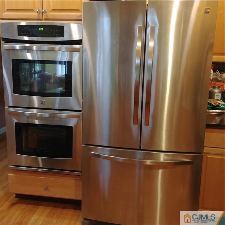 21 Frances Road Edison, NJ 08820 - Photo 5 of 20 a view of a fireplace with washer and dryer