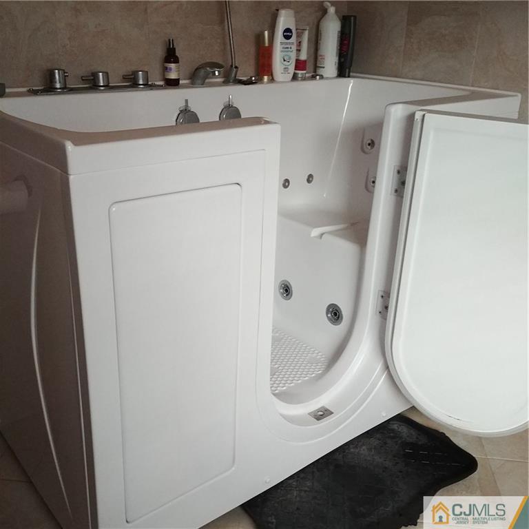 21 Frances Road Edison, NJ 08820 - Photo 7 of 20 a bathroom with a sink a mirror and shower
