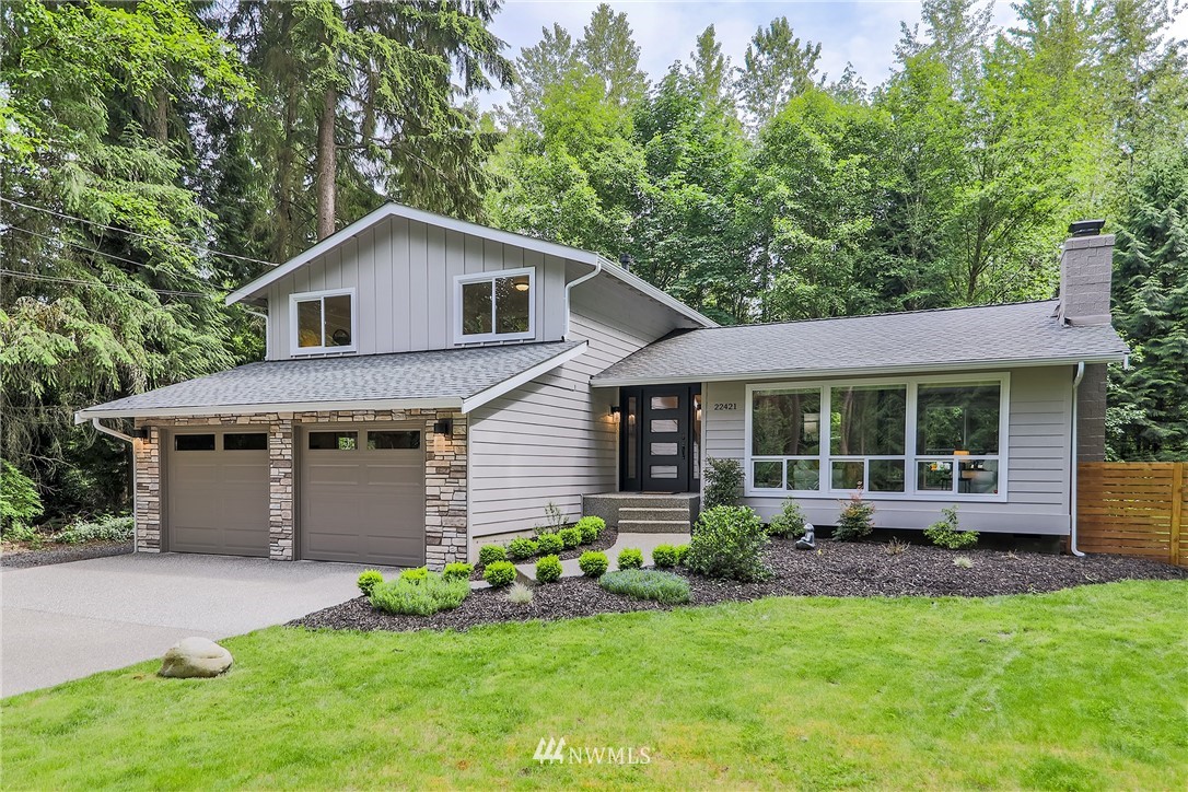 22421 53rd Avenue Southeast Bothell, WA 98021 - Photo 2 of 31 a front view of a house with a garden and porch