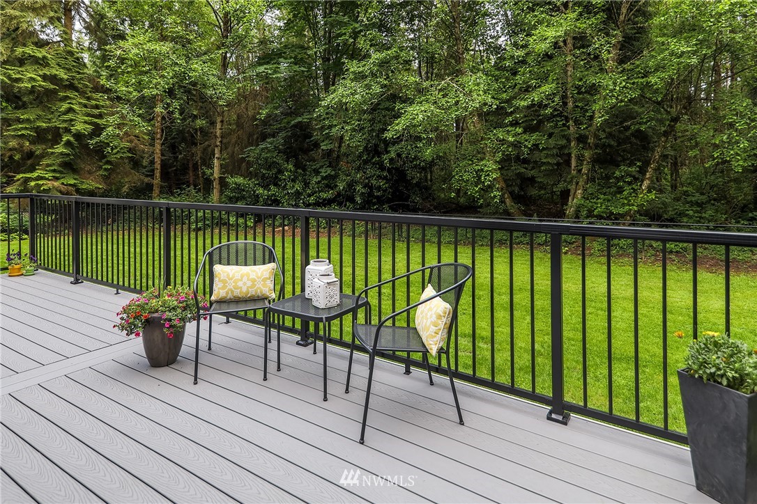 22421 53rd Avenue Southeast Bothell, WA 98021 - Photo 13 of 31 a view of a lake with a table and chairs