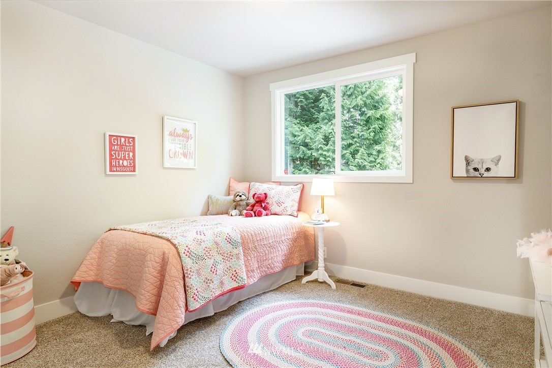 22421 53rd Avenue Southeast Bothell, WA 98021 - Photo 21 of 31 a bedroom with a bed and a window