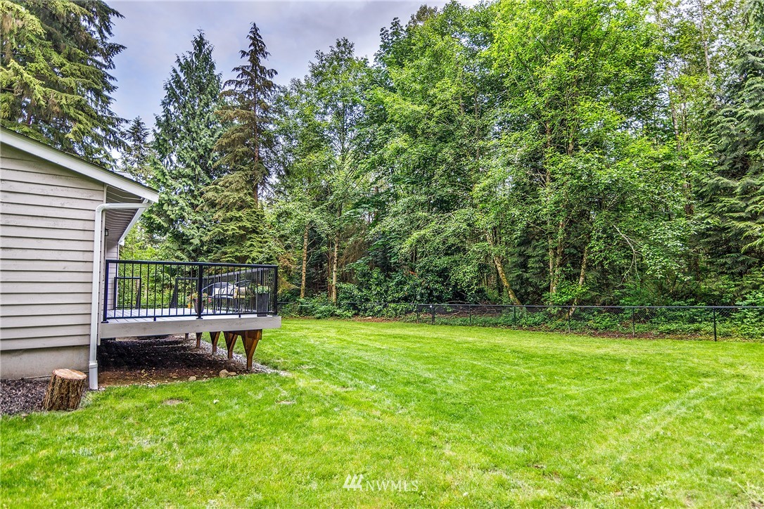 22421 53rd Avenue Southeast Bothell, WA 98021 - Photo 24 of 31 a view of a chair and tables in the back yard