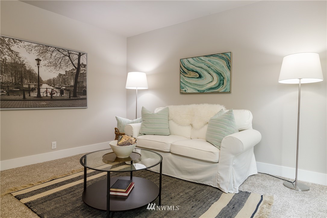 22421 53rd Avenue Southeast Bothell, WA 98021 - Photo 27 of 31 a living room with furniture and a wall painting