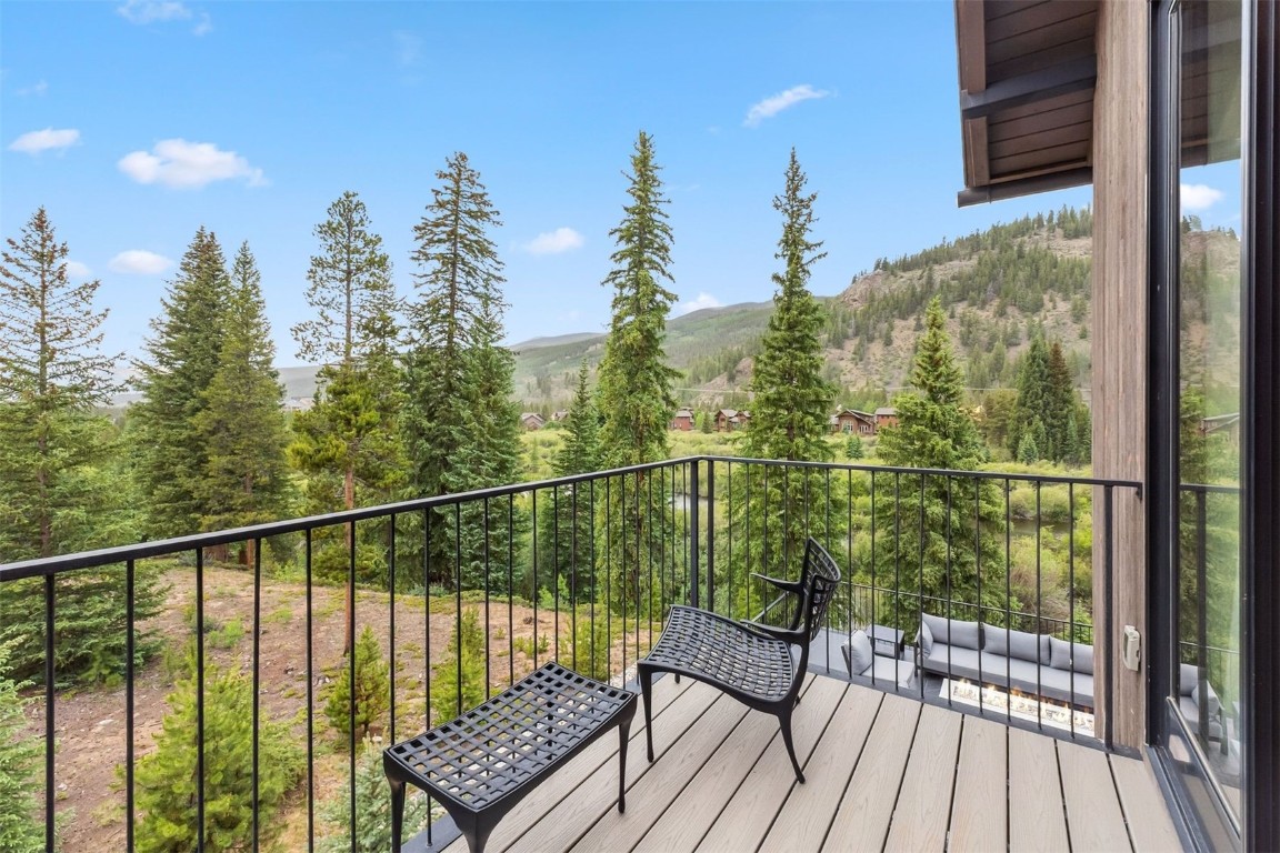 628 Independence Road Keystone, CO 80435 - Photo 16 of 50 a view of a balcony with wooden floor and outdoor seating