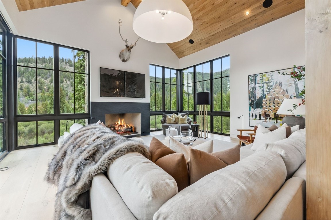 628 Independence Road Keystone, CO 80435 - Photo 45 of 50 a living room with furniture fireplace and large windows