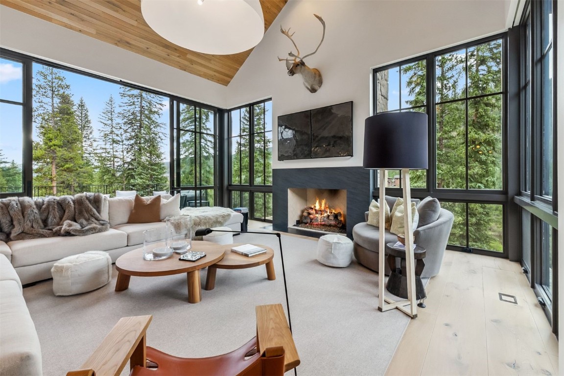 628 Independence Road Keystone, CO 80435 - Photo 8 of 50 a living room with furniture a fireplace and a floor to ceiling window