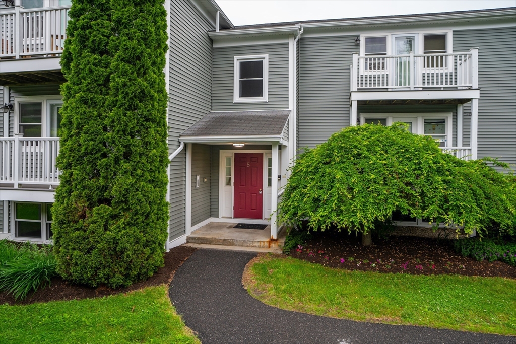 48 Evergreen Road, Unit 212 Leeds, MA 01053 - Photo 2 of 34 a front view of a house with a yard
