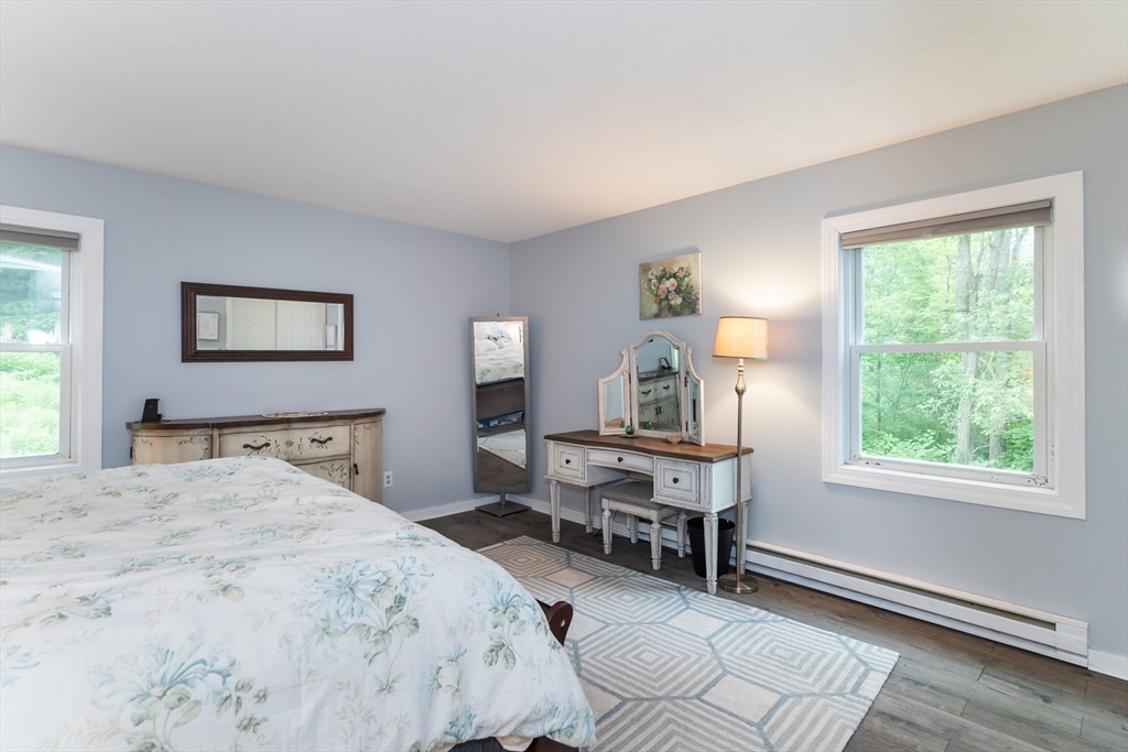 48 Evergreen Road, Unit 212 Leeds, MA 01053 - Photo 22 of 34 a bedroom with a bed and a window