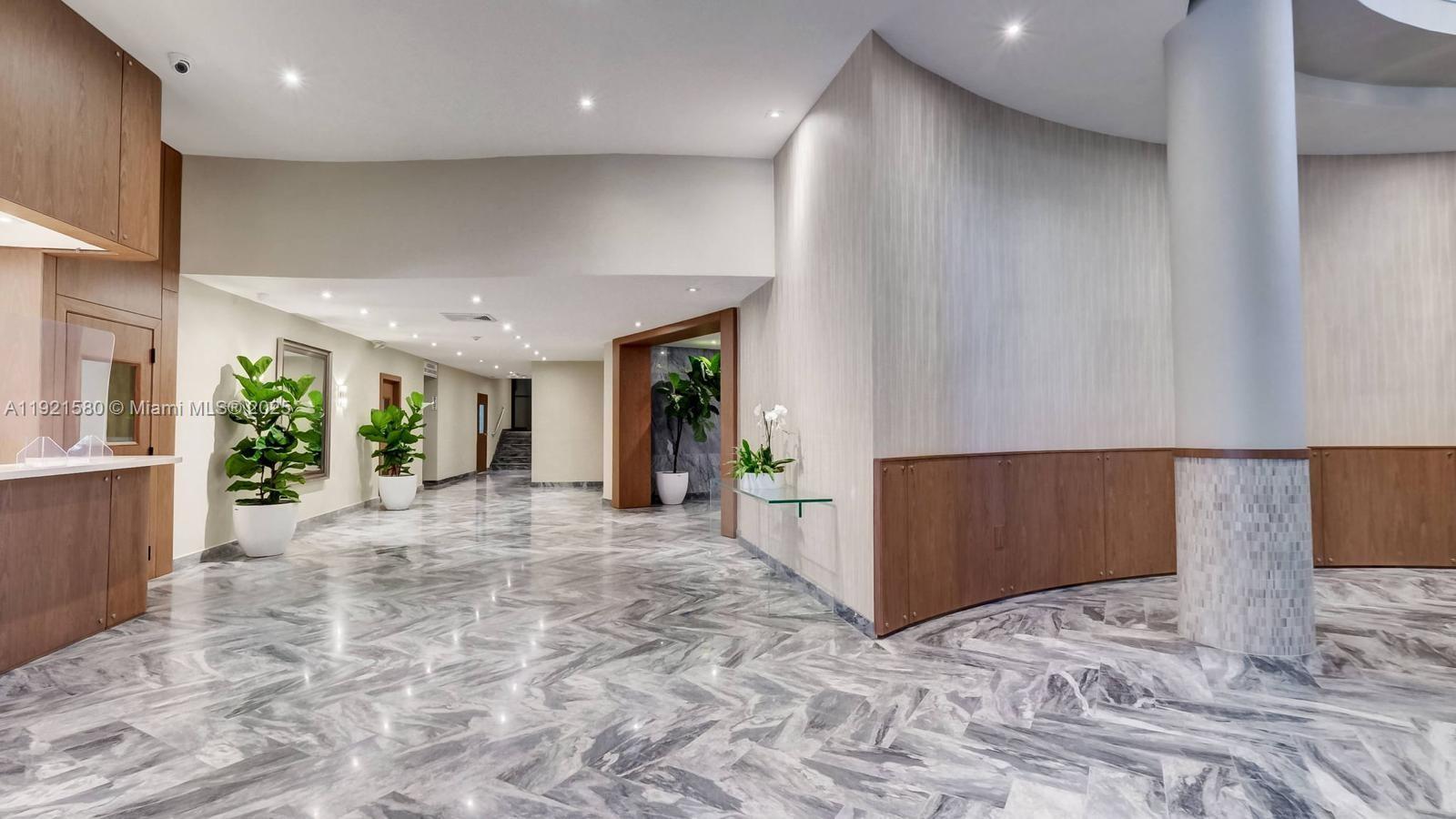 5401 Collins Avenue, Unit 340 Miami Beach, FL 33140 - Photo 19 of 54 a view of a hallway with a window