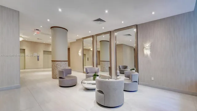 a view of a swimming pool with seating area