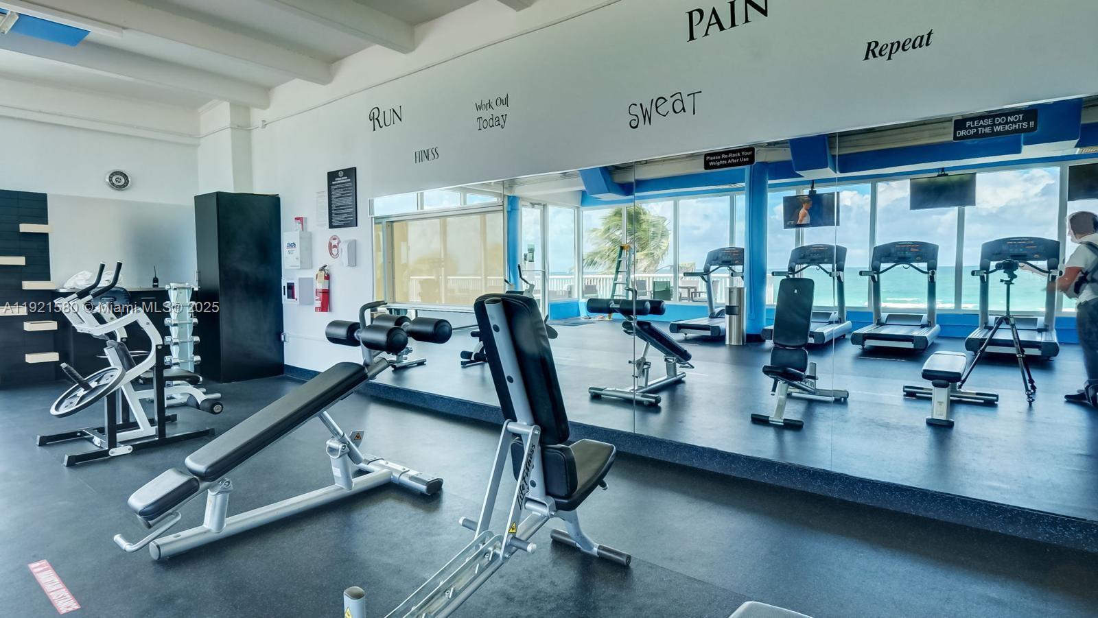 5401 Collins Avenue, Unit 340 Miami Beach, FL 33140 - Photo 31 of 54 a view of a room with gym equipment