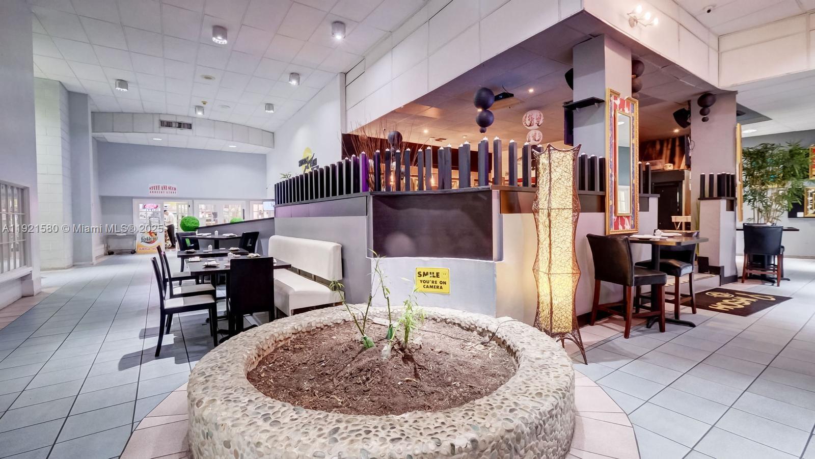 5401 Collins Avenue, Unit 340 Miami Beach, FL 33140 - Photo 35 of 54 a living room with furniture and a dining table